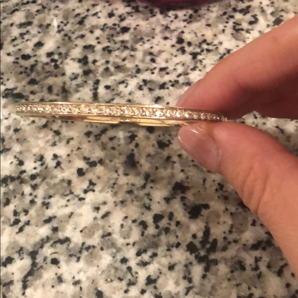 Givenchy bangle with diamonds on top half.